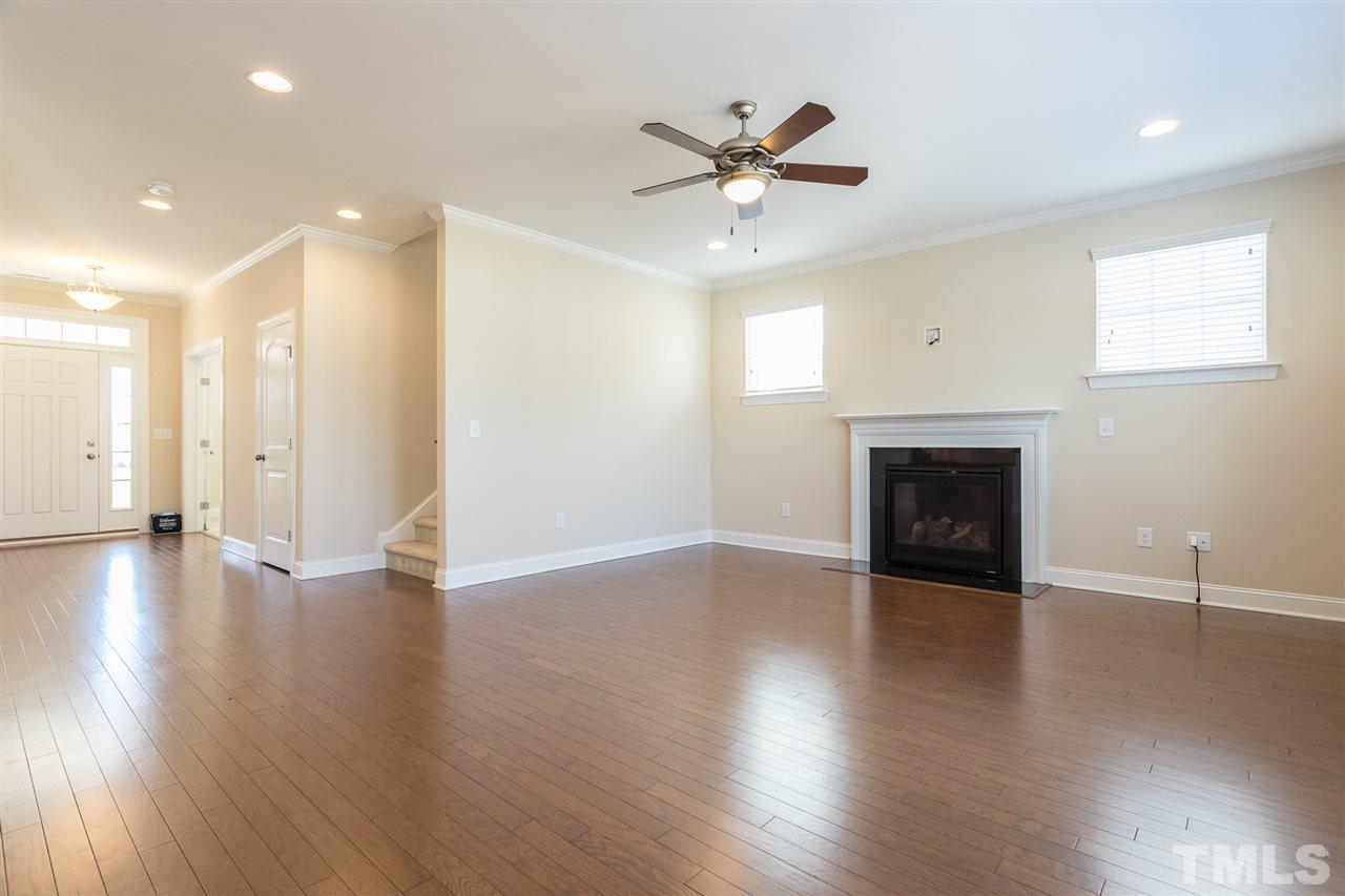 4244 Rockdell Hall Street Raleigh, NC 27616 - Photo 9 of 29 a view of an empty room with wooden floor and a window