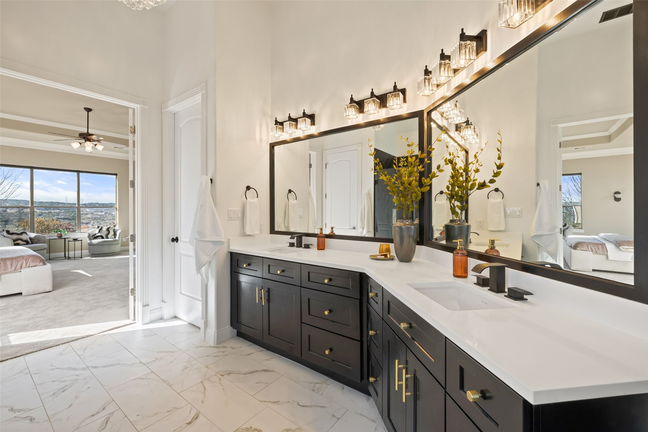 2702 Lakehurst Road Spicewood, TX 78669 - Photo 27 of 40 a spacious bathroom with a double vanity sink mirror and double
