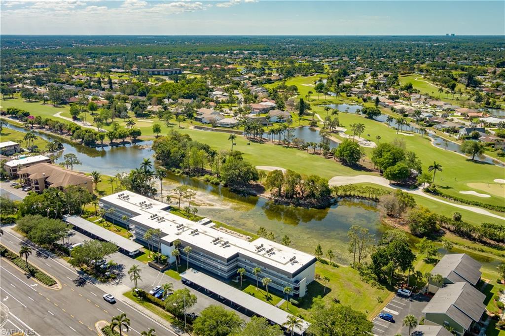 5515 Rattlesnake Hammock Road, Unit 205 Naples, FL 34113 - Photo 35 of 46 Birds eye view of property with a water view
