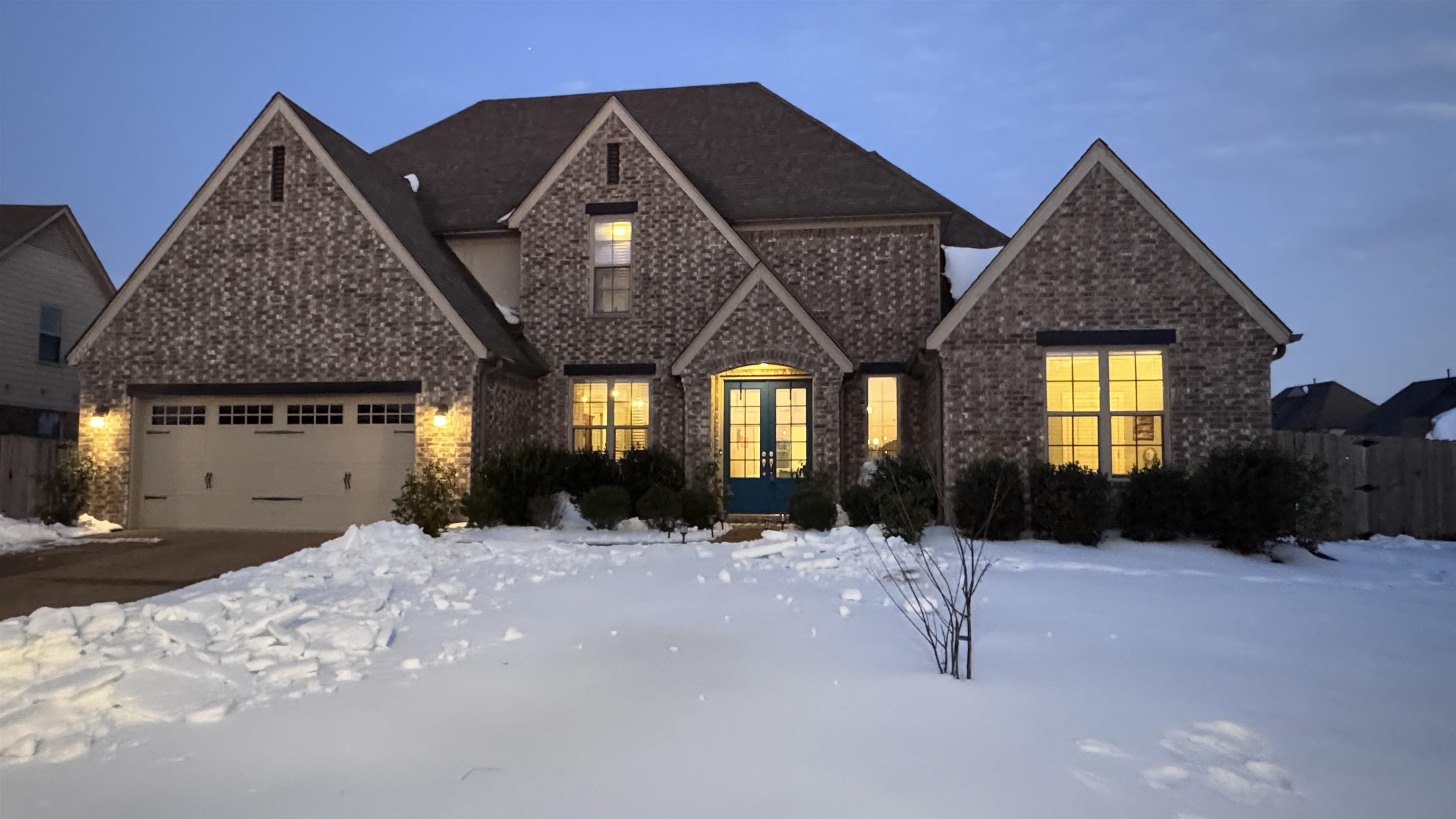 6374 Rutherford Circle Arlington, TN 38002 - Photo 16 of 40 French country home featuring french doors, brick siding, and an attached garage.