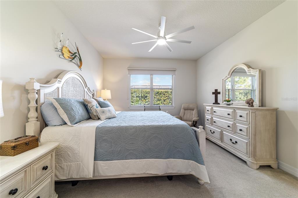 6382 Southwest 97th Terrace Road Ocala, FL 34481 - Photo 22 of 56 a bedroom with a bed and a dresser