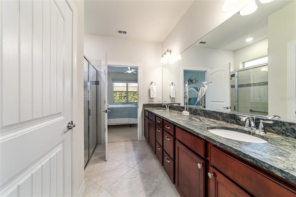 6382 Southwest 97th Terrace Road Ocala, FL 34481 - Photo 24 of 56 a kitchen with granite countertop a sink and a refrigerator