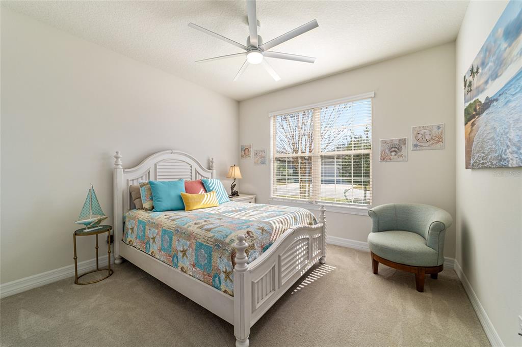 6382 Southwest 97th Terrace Road Ocala, FL 34481 - Photo 29 of 56 a bedroom with a bed bed and a window