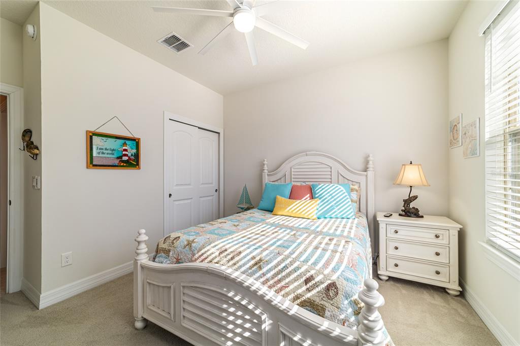 6382 Southwest 97th Terrace Road Ocala, FL 34481 - Photo 30 of 56 a bedroom with a bed and a window