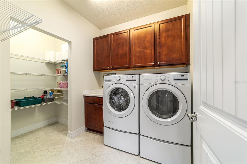 6382 Southwest 97th Terrace Road Ocala, FL 34481 - Photo 32 of 56 a view of a storage & utility room with washer and dryer