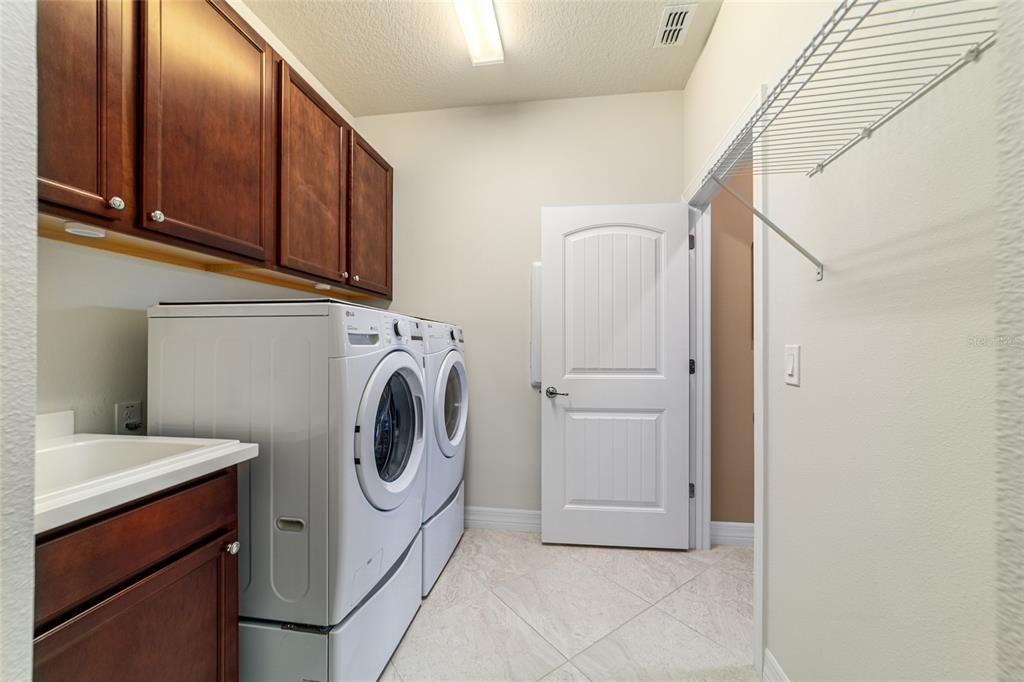 6382 Southwest 97th Terrace Road Ocala, FL 34481 - Photo 33 of 56 a utility room with dryer and washer