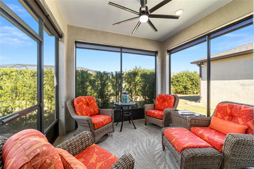 6382 Southwest 97th Terrace Road Ocala, FL 34481 - Photo 34 of 56 a living room with patio furniture and a large window
