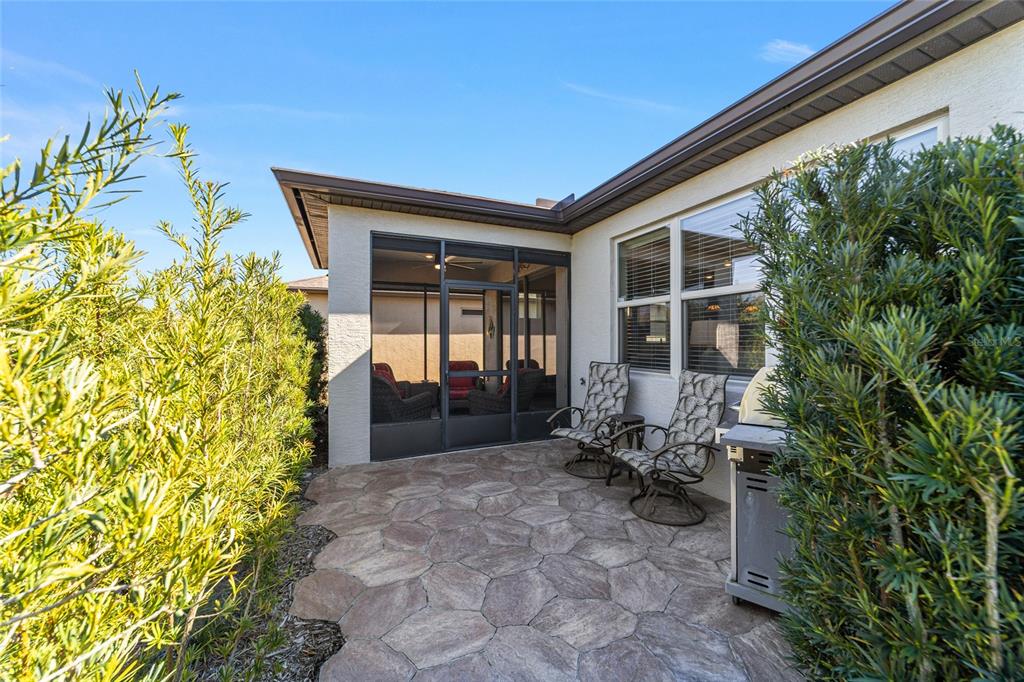 6382 Southwest 97th Terrace Road Ocala, FL 34481 - Photo 38 of 56 a porch with table and chairs