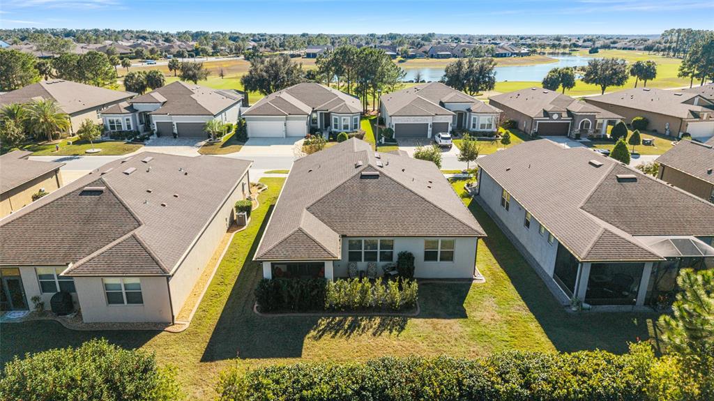 6382 Southwest 97th Terrace Road Ocala, FL 34481 - Photo 42 of 56 an aerial view of a house with a yard