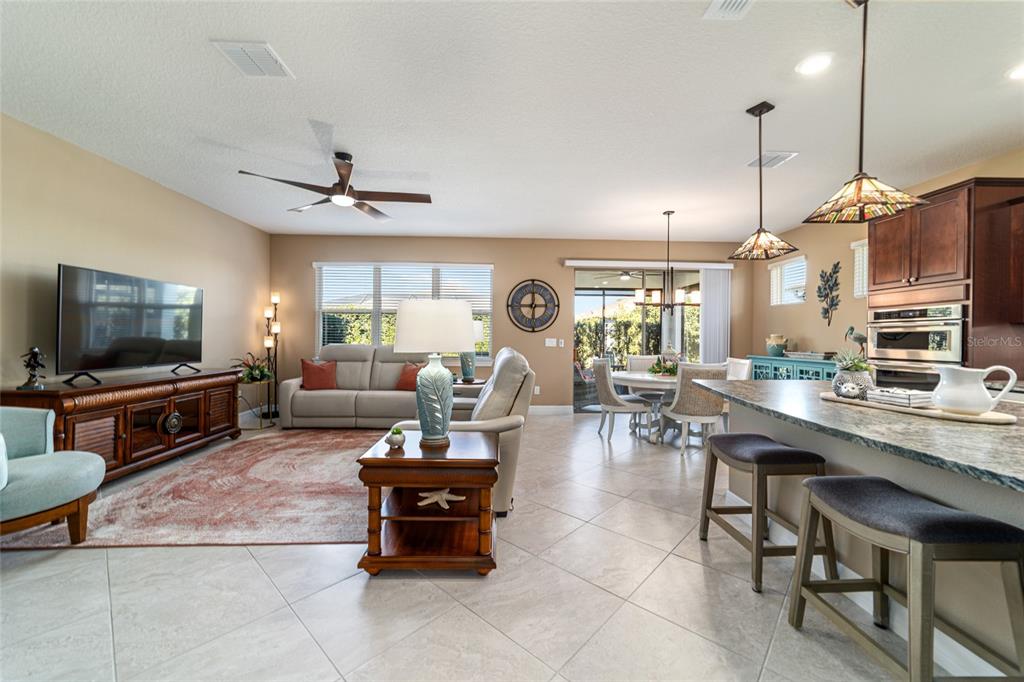 6382 Southwest 97th Terrace Road Ocala, FL 34481 - Photo 5 of 56 a living room with furniture and a flat screen tv
