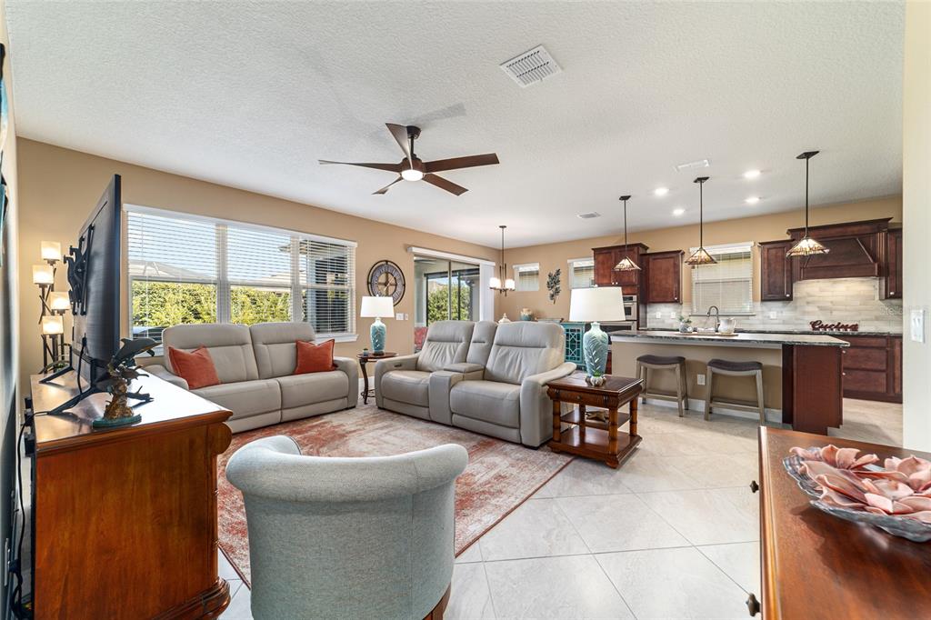 6382 Southwest 97th Terrace Road Ocala, FL 34481 - Photo 8 of 56 a living room with furniture kitchen and a large window