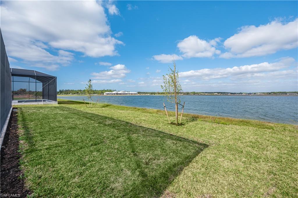 9127 Wisteria Way Naples, FL 34114 - Photo 11 of 50 a view of a lake with a big yard