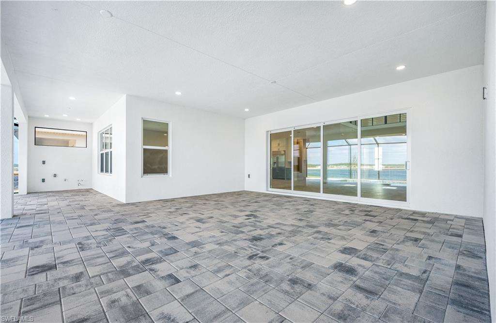 9127 Wisteria Way Naples, FL 34114 - Photo 13 of 50 a view of an empty room with a window
