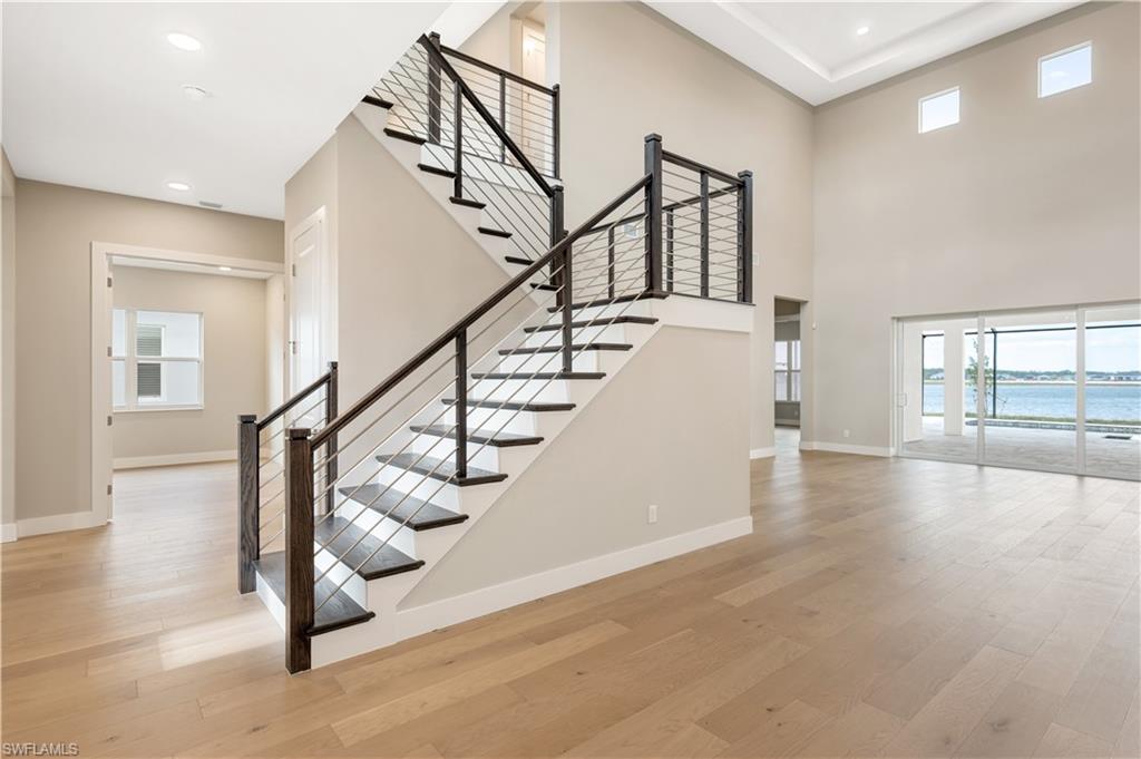 9127 Wisteria Way Naples, FL 34114 - Photo 16 of 50 a view of entryway and hall with wooden floor