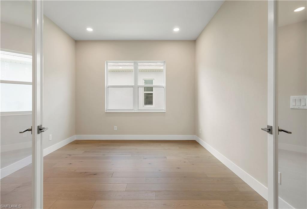 9127 Wisteria Way Naples, FL 34114 - Photo 23 of 50 a view of an empty room with a window