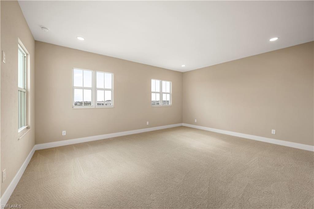 9127 Wisteria Way Naples, FL 34114 - Photo 32 of 50 an empty room with windows