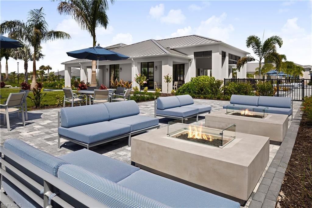 9127 Wisteria Way Naples, FL 34114 - Photo 46 of 50 a view of a patio with couches and a table and chairs with garden view