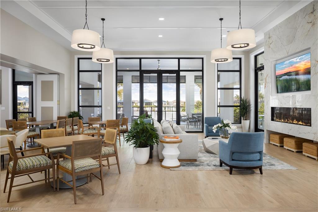 9127 Wisteria Way Naples, FL 34114 - Photo 47 of 50 a living room with furniture and a flat screen tv