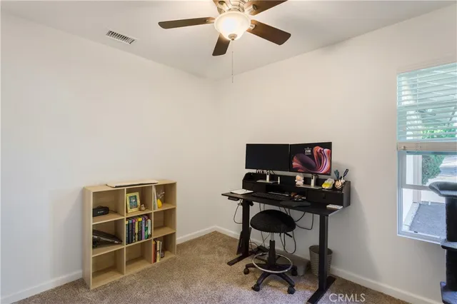 a view of a workspace with furniture