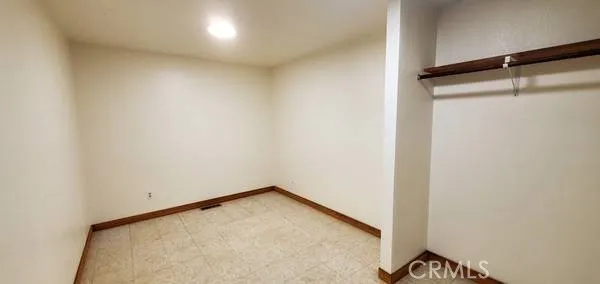 a view of a room with a close up view of a shower