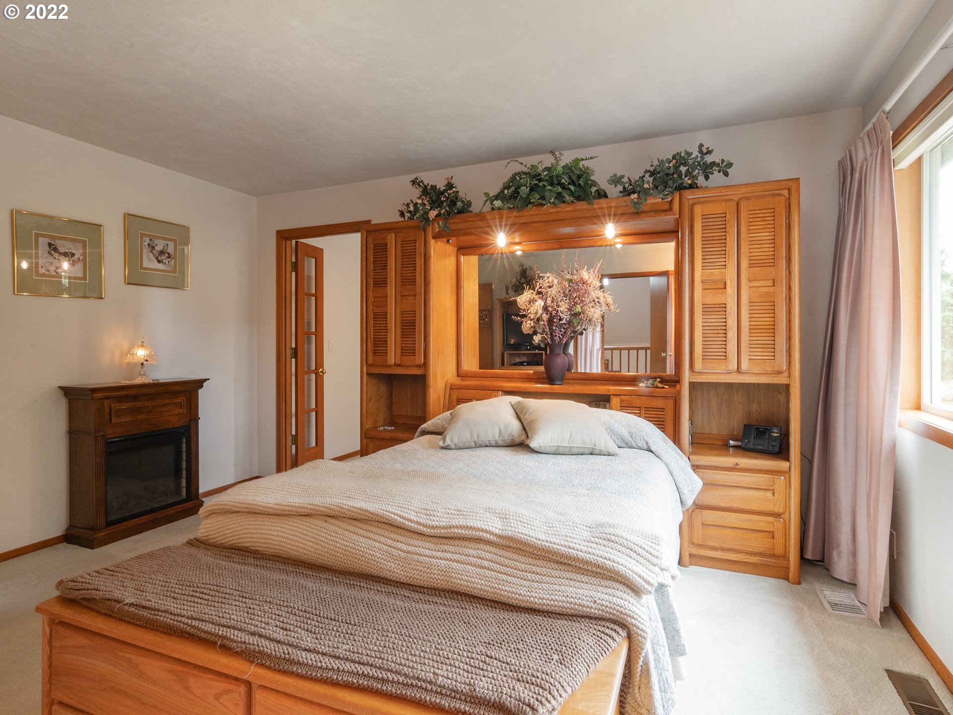 37870 Shenandoah Loop Springfield, OR 97478 - Photo 17 of 32 a bedroom with a bed and a fireplace