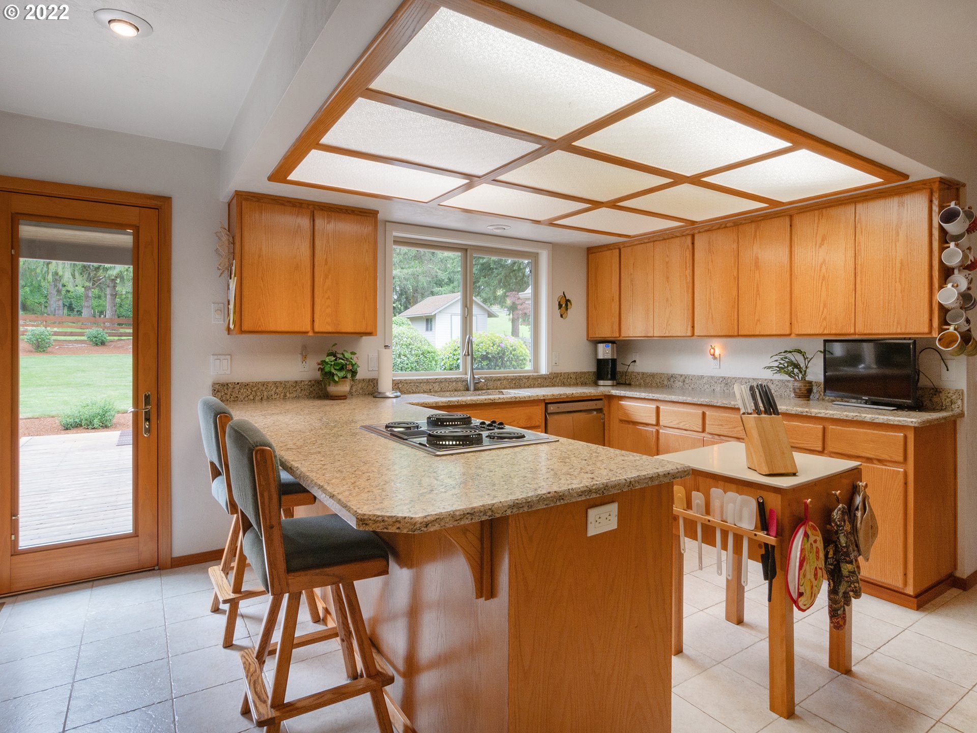 37870 Shenandoah Loop Springfield, OR 97478 - Photo 6 of 32 a kitchen with stainless steel appliances granite countertop a stove a sink and a refrigerator