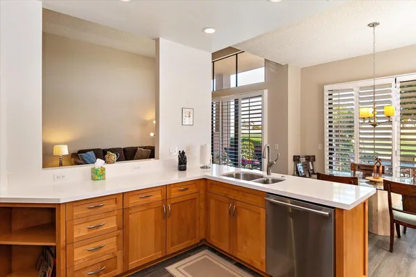 a spacious bathroom with double vanity and a mirror