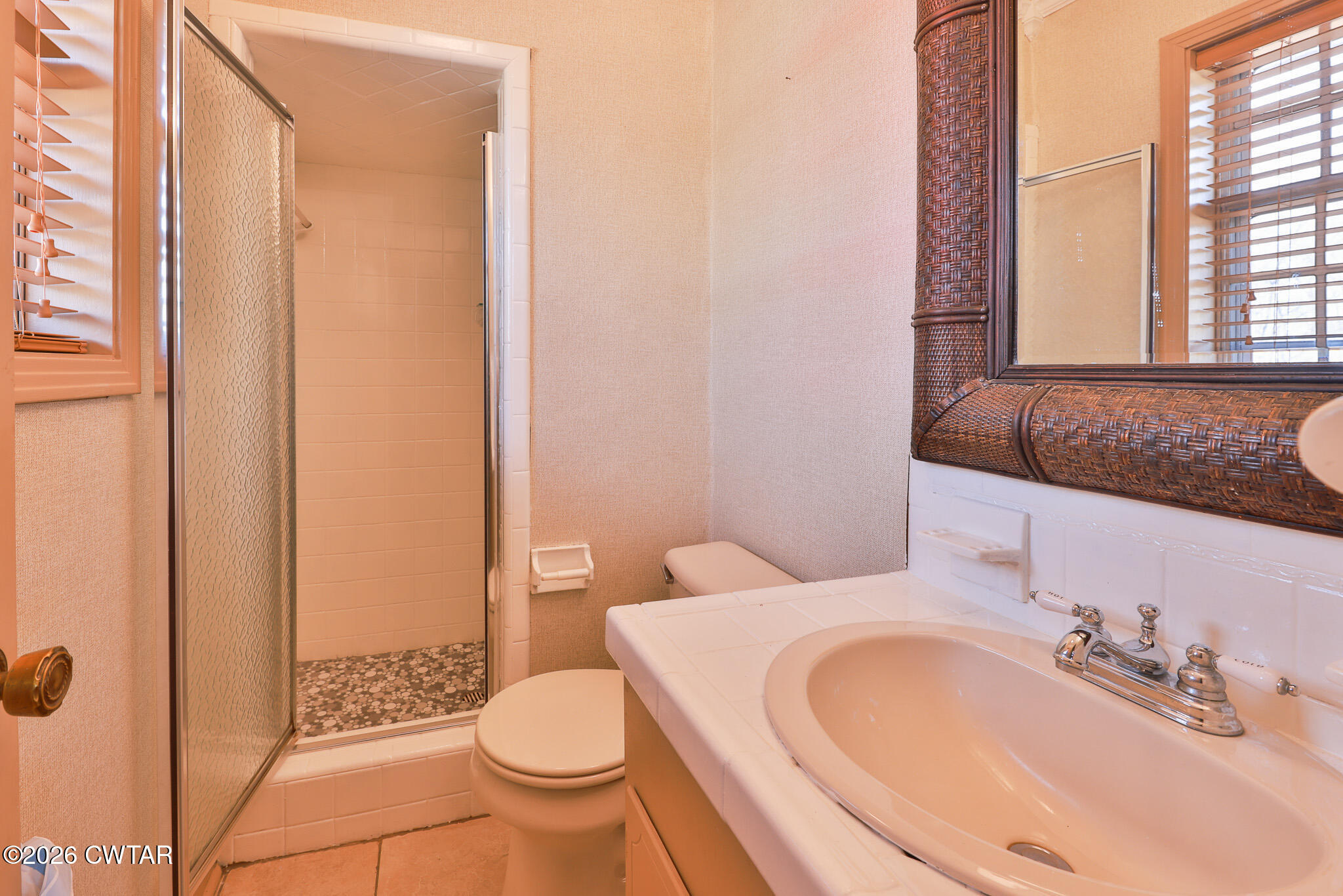 295 Adams Road Greenfield, TN 38230 - Photo 12 of 35 a bathroom with a granite countertop sink toilet and shower