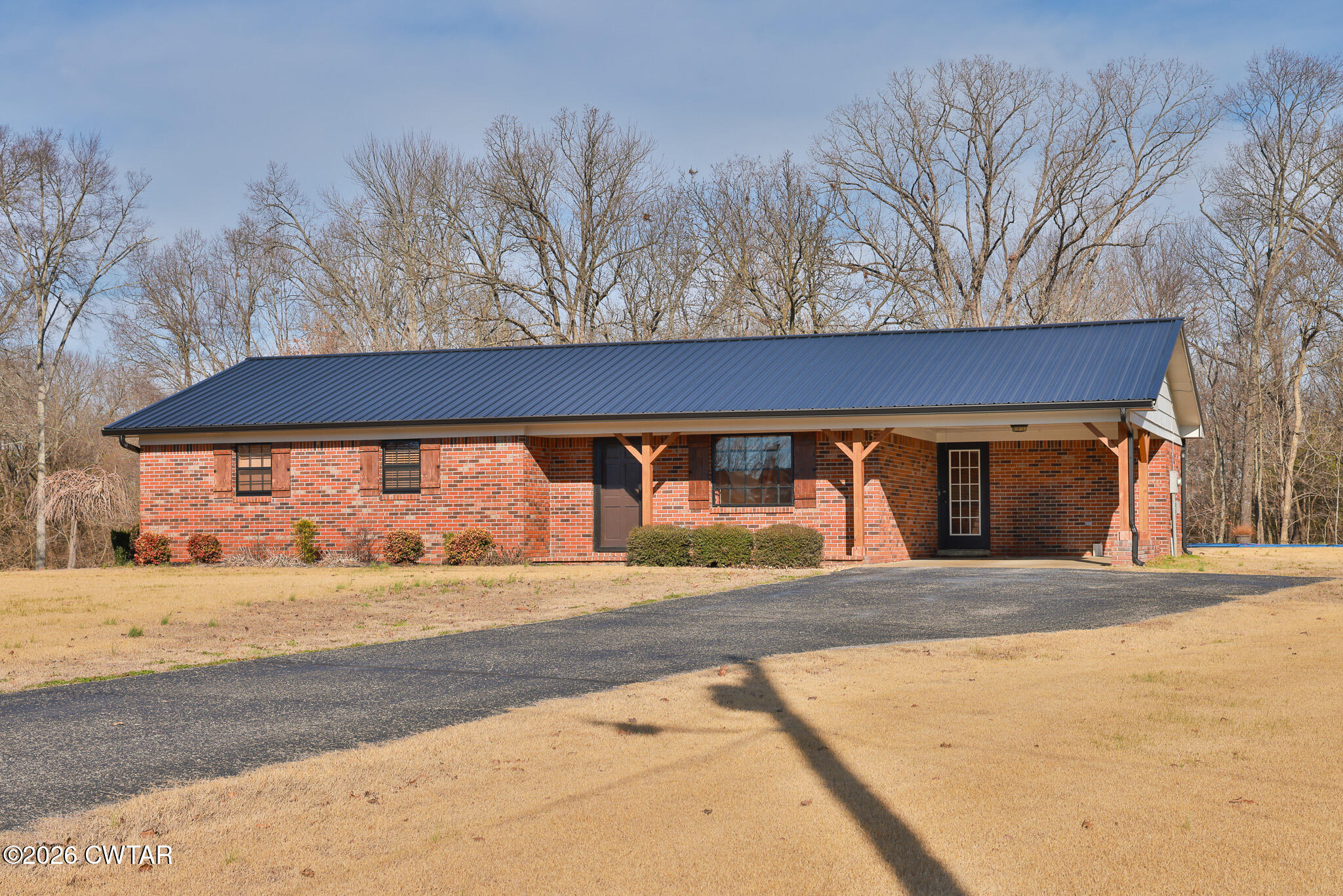 295 Adams Road Greenfield, TN 38230 - Photo 29 of 35 a view of a house with a snow and yard