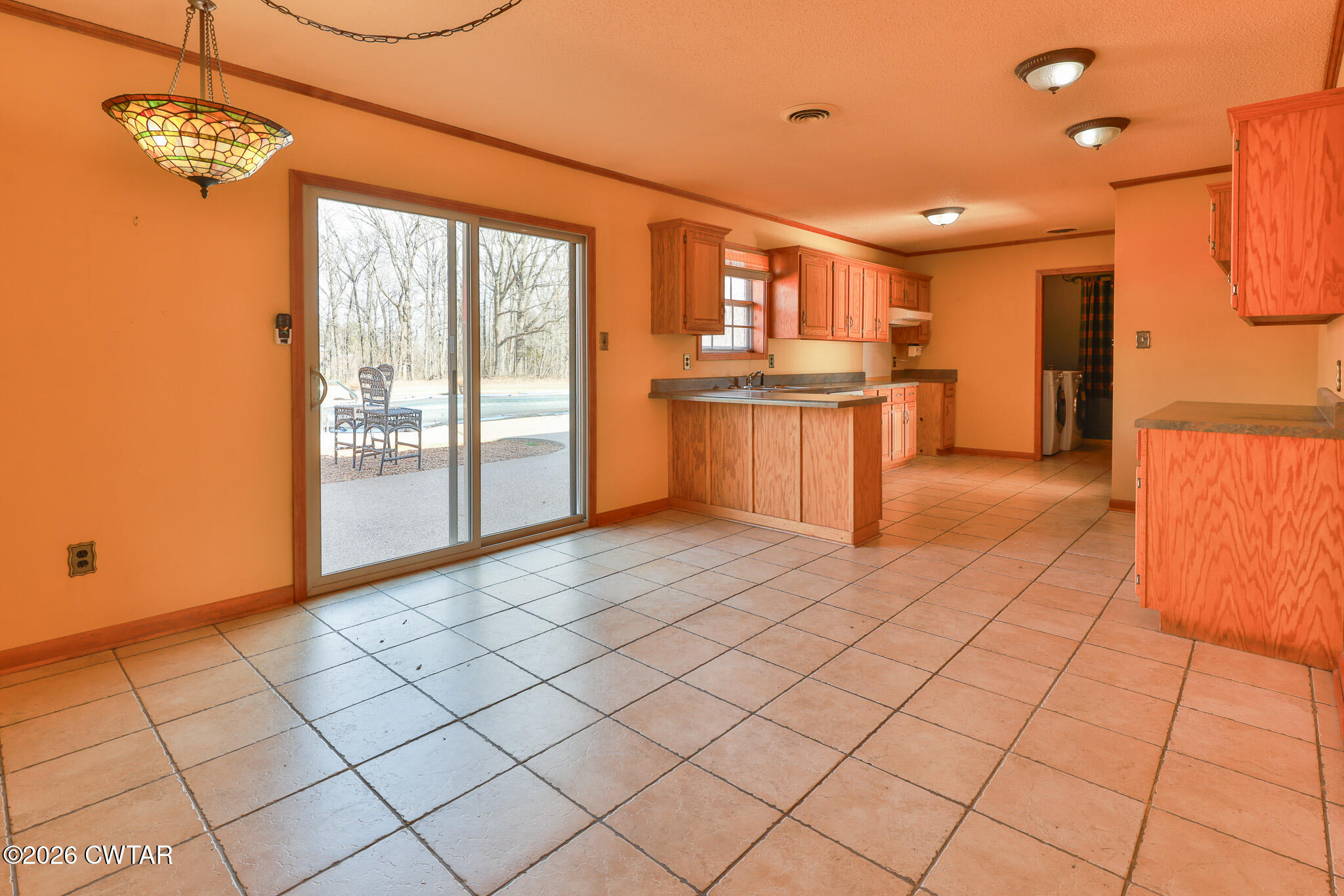 295 Adams Road Greenfield, TN 38230 - Photo 3 of 35 a large kitchen with a sink and cabinets