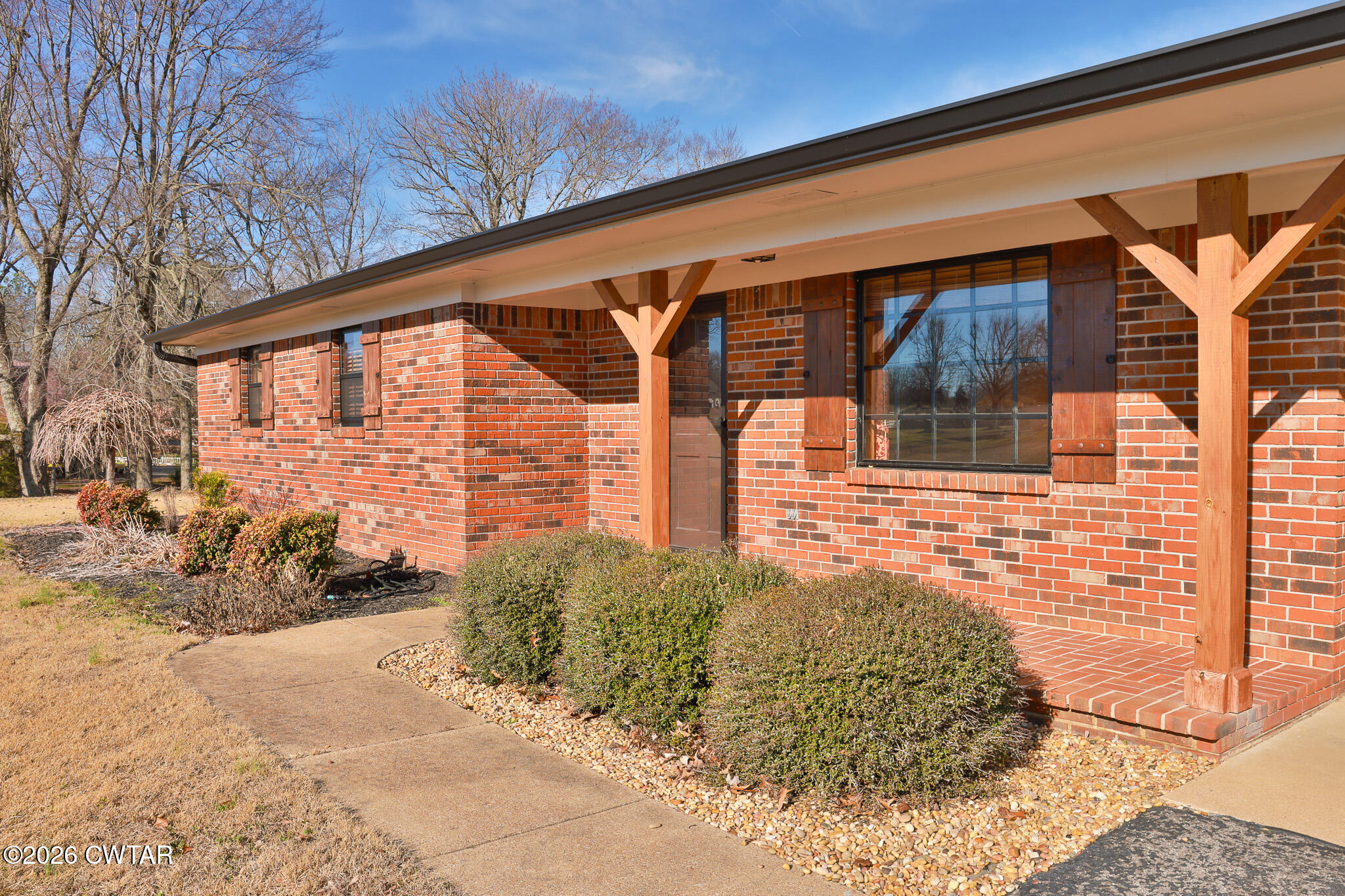 295 Adams Road Greenfield, TN 38230 - Photo 32 of 35 a view of a house with a yard