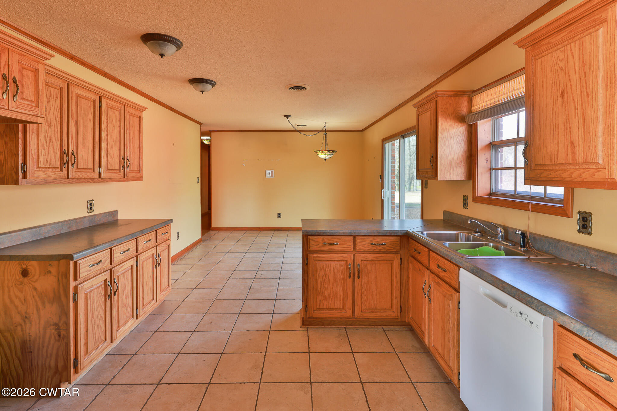 295 Adams Road Greenfield, TN 38230 - Photo 4 of 35 a large kitchen with stainless steel appliances granite countertop a sink and cabinets
