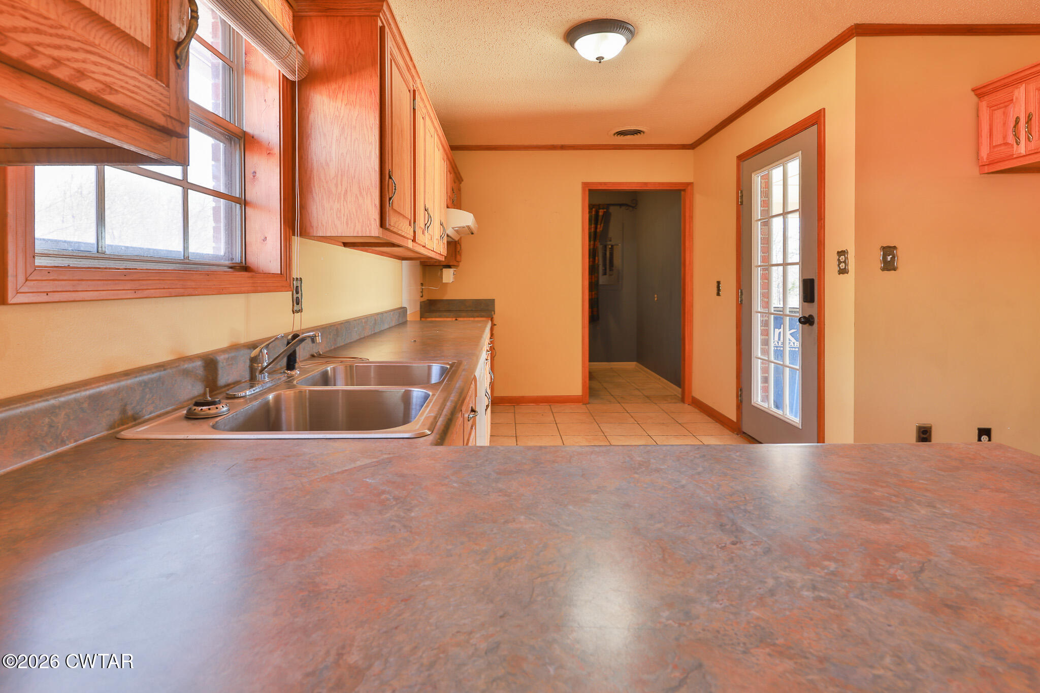 295 Adams Road Greenfield, TN 38230 - Photo 5 of 35 a view of a kitchen with stainless steel appliances granite countertop a sink and a window