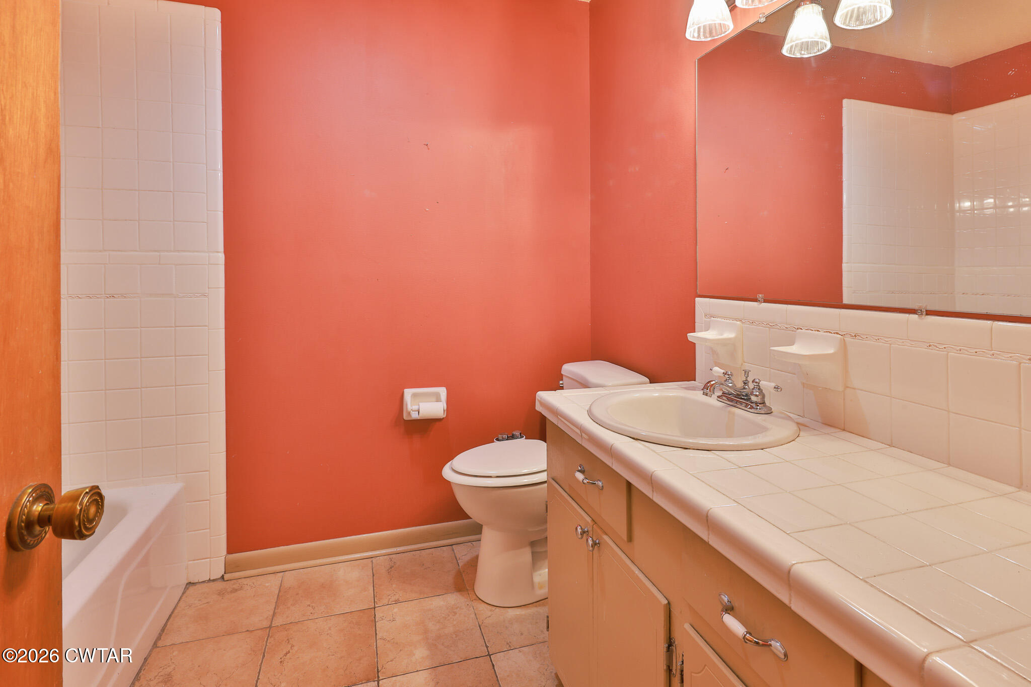 295 Adams Road Greenfield, TN 38230 - Photo 9 of 35 a bathroom with a sink a toilet and a mirror