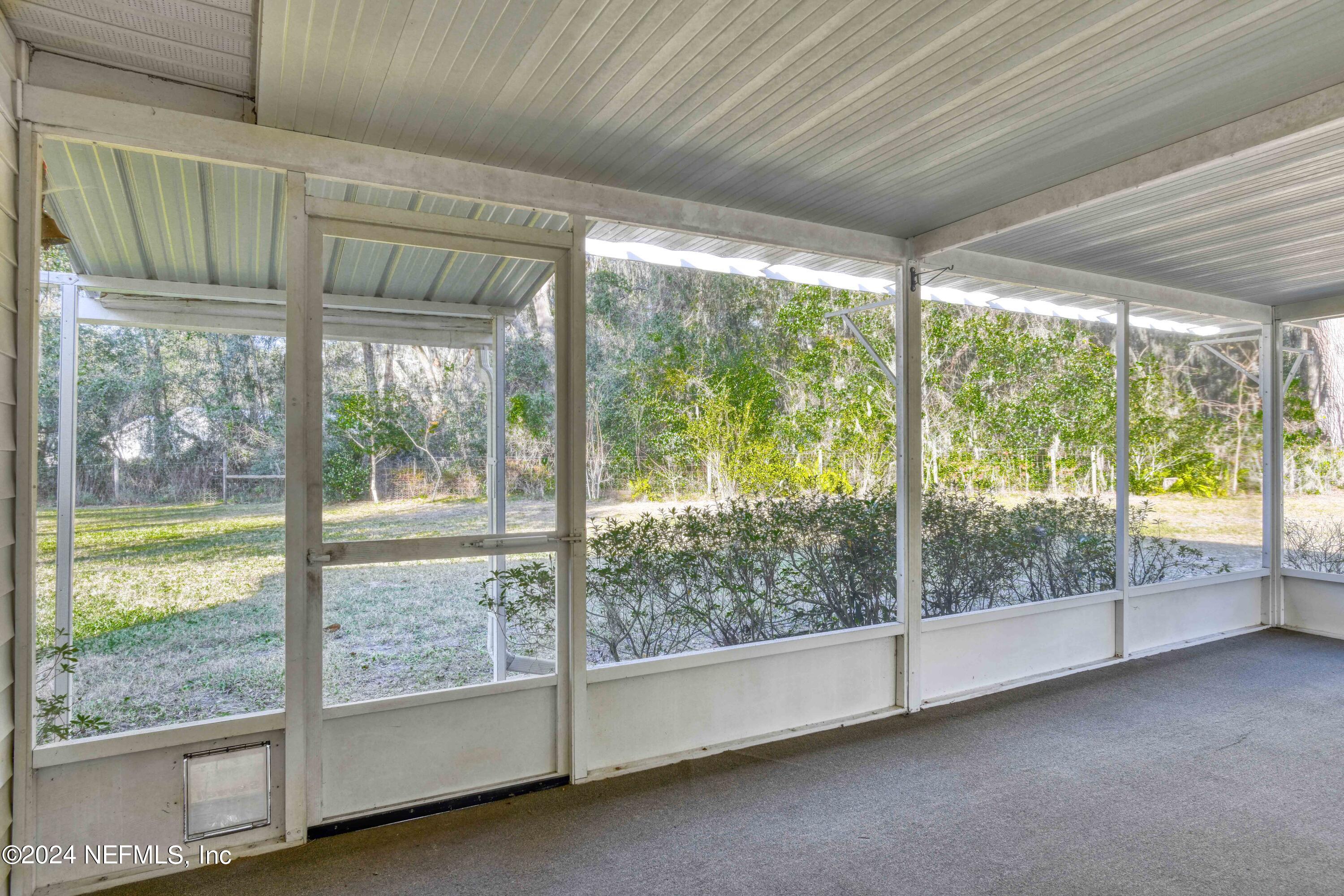390 East End Road San Mateo, FL 32187 - Photo 34 of 54 Screened porch