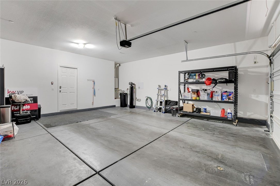 484 Filaree Place Henderson, NV 89015 - Photo 55 of 71 A well-maintained garage offers ample space and overhead lighting for practical living.