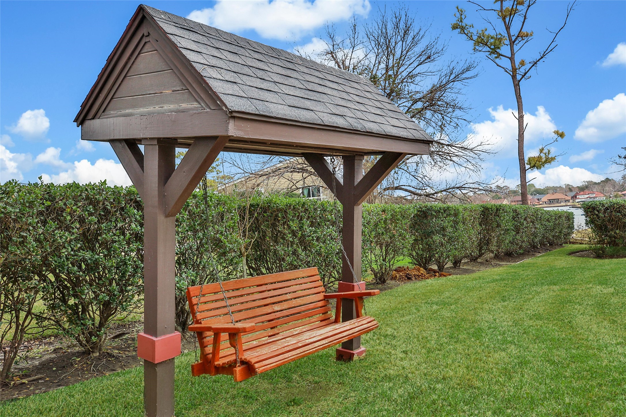 1000 April Sound Boulevard Conroe, TX 77356 - Photo 40 of 46 a backyard of a house with wooden floor table and chairs