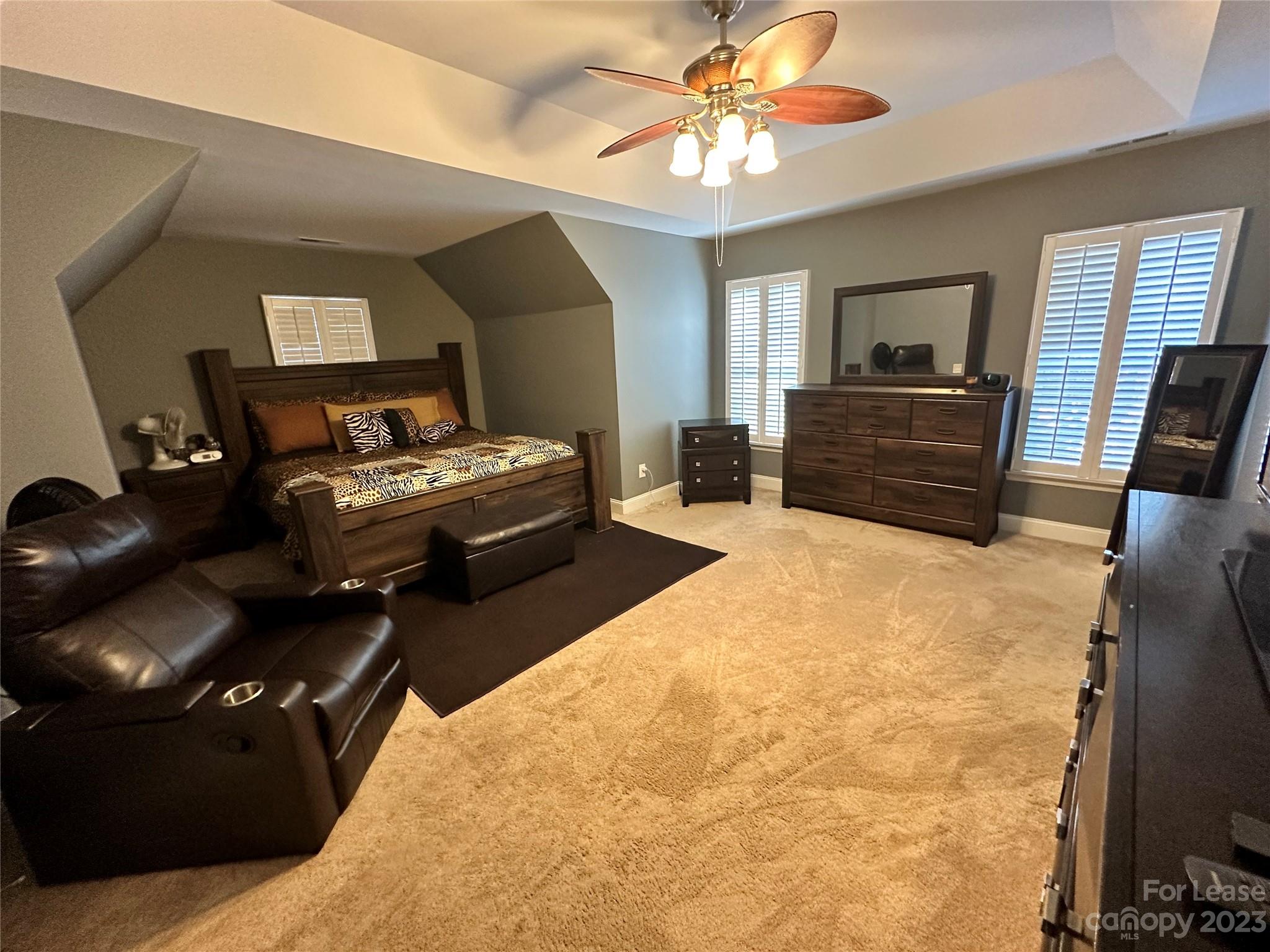 109 Windstone Drive Troutman, NC 28166 - Photo 11 of 22 a bedroom with a bed and wooden floor