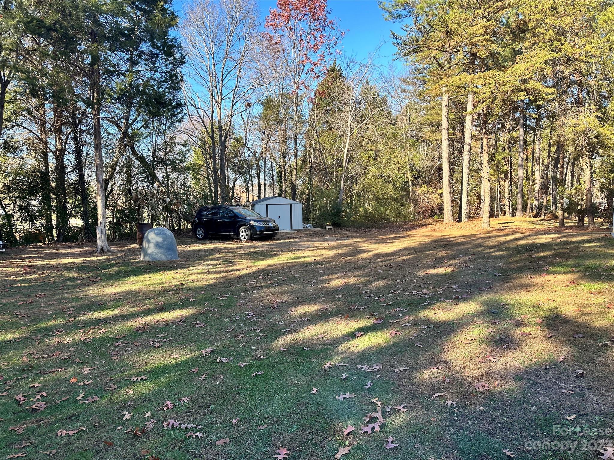 109 Windstone Drive Troutman, NC 28166 - Photo 20 of 22 a view of road with trees