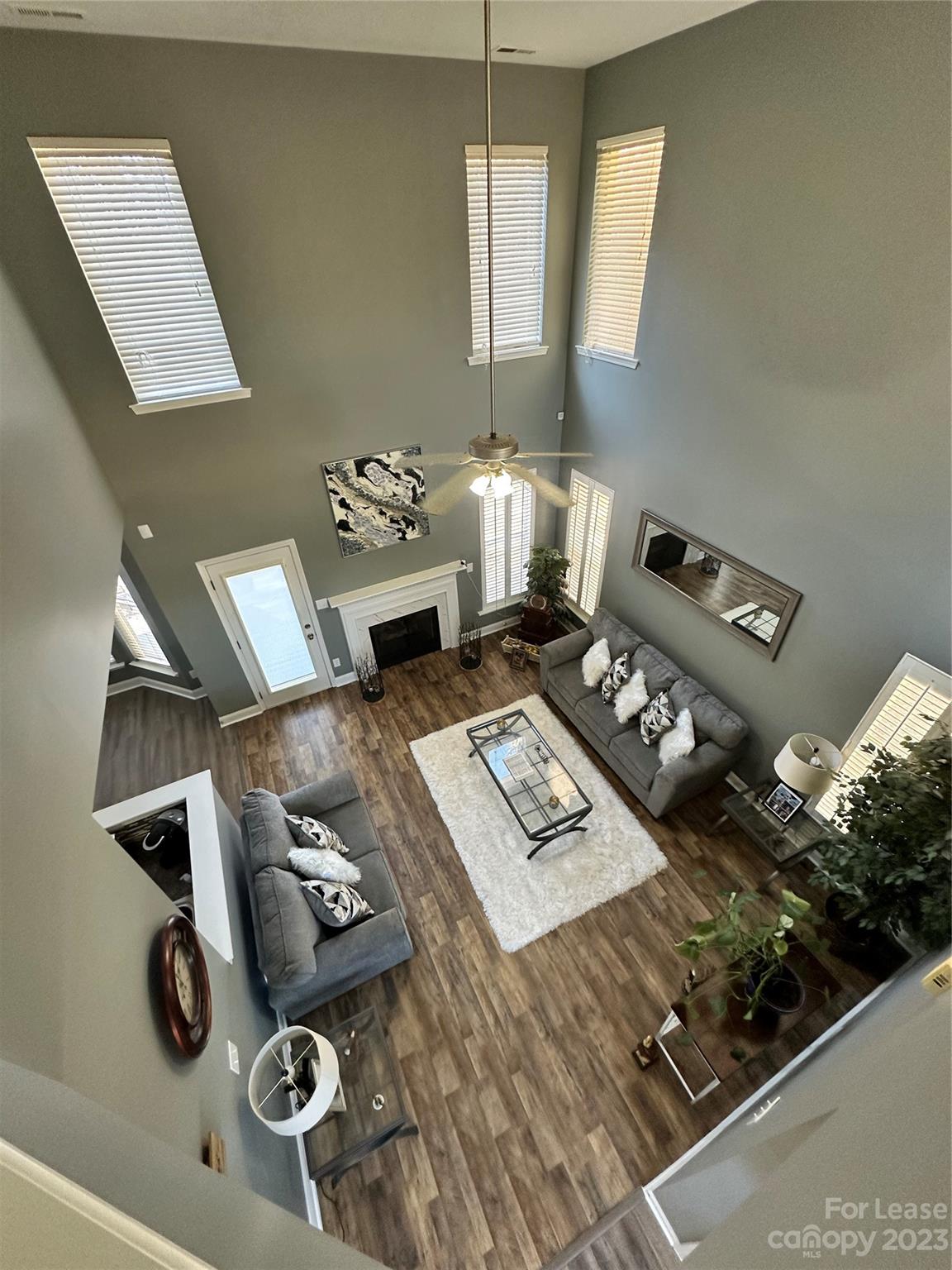 109 Windstone Drive Troutman, NC 28166 - Photo 3 of 22 a living room with furniture and a book shelf