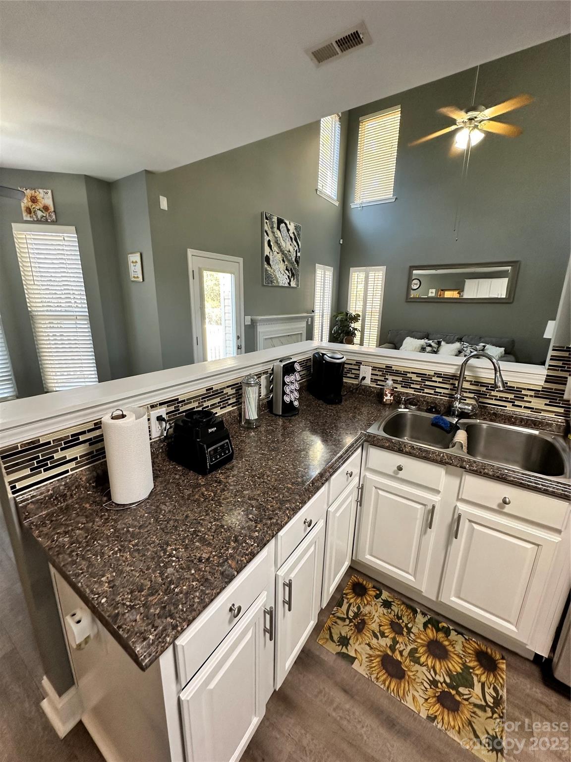 109 Windstone Drive Troutman, NC 28166 - Photo 5 of 22 a kitchen with a sink a stove and cabinets