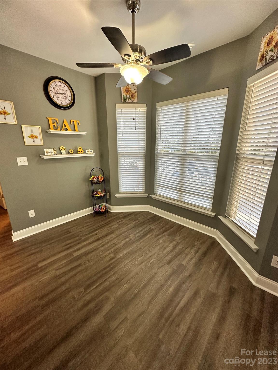 109 Windstone Drive Troutman, NC 28166 - Photo 7 of 22 a view of a room with gym equipment and large windows