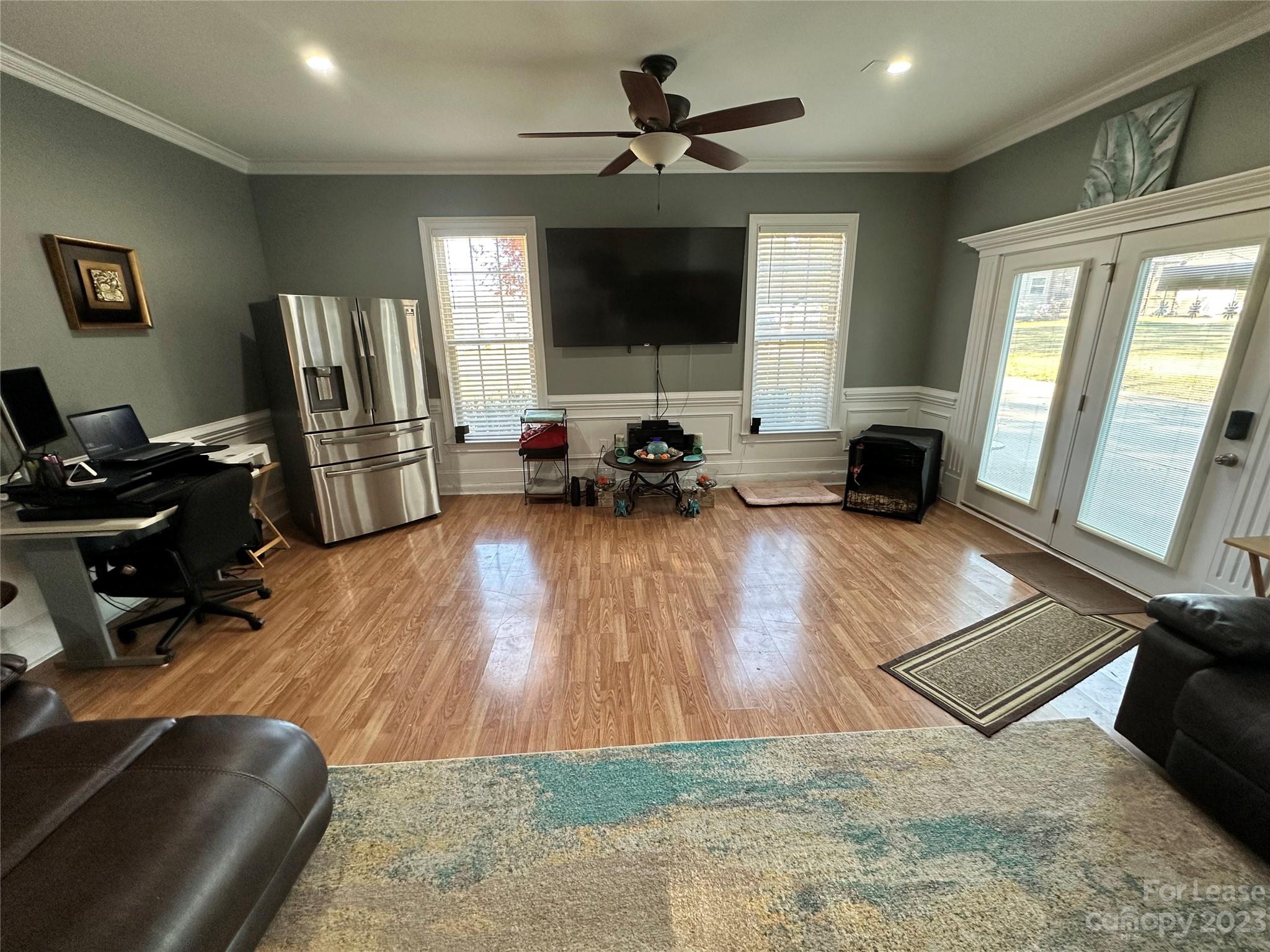 109 Windstone Drive Troutman, NC 28166 - Photo 9 of 22 a living room with furniture and a flat screen tv