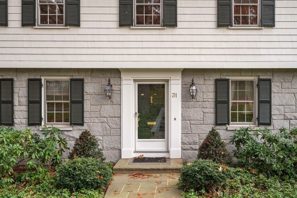 a potted plant in front of a house