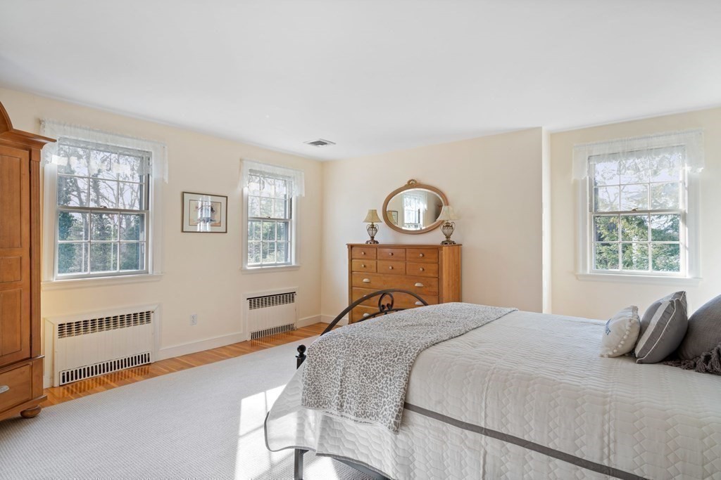 31 Lathrop Road Wellesley, MA 02482 - Photo 20 of 27 a bedroom with a bed and a window