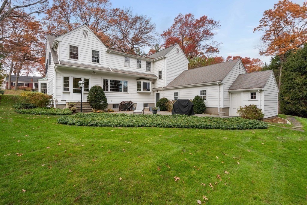 31 Lathrop Road Wellesley, MA 02482 - Photo 26 of 27 a front view of house with yard and green space