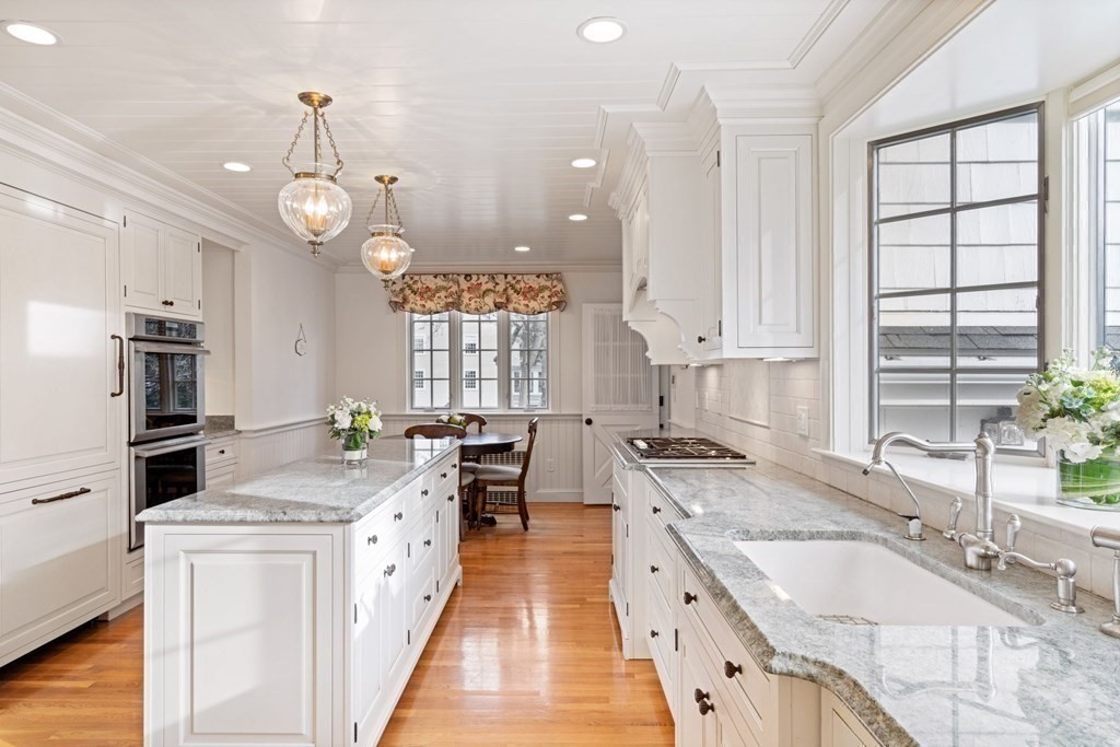 31 Lathrop Road Wellesley, MA 02482 - Photo 9 of 27 a large kitchen with granite countertop a sink a counter space appliances and cabinets