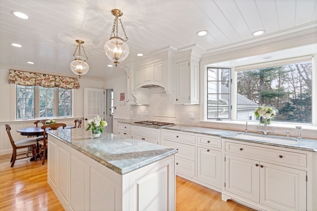31 Lathrop Road Wellesley, MA 02482 - Photo 10 of 27 a kitchen with center island and windows