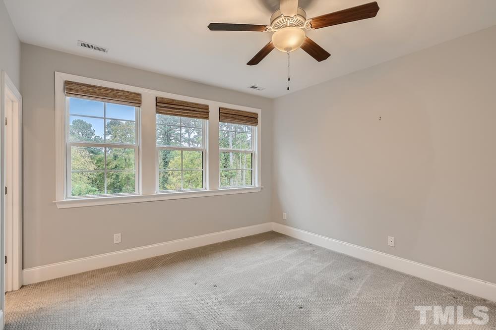 1604 Bowery Drive Raleigh, NC 27607 - Photo 14 of 28 an empty room with a window and a fan