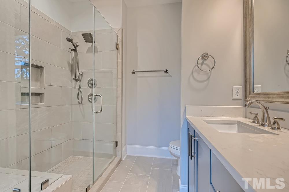 1604 Bowery Drive Raleigh, NC 27607 - Photo 15 of 28 a bathroom with a shower and a sink